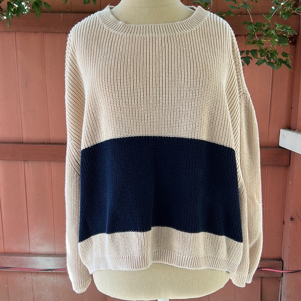 Knit cream sweater with navy blue.